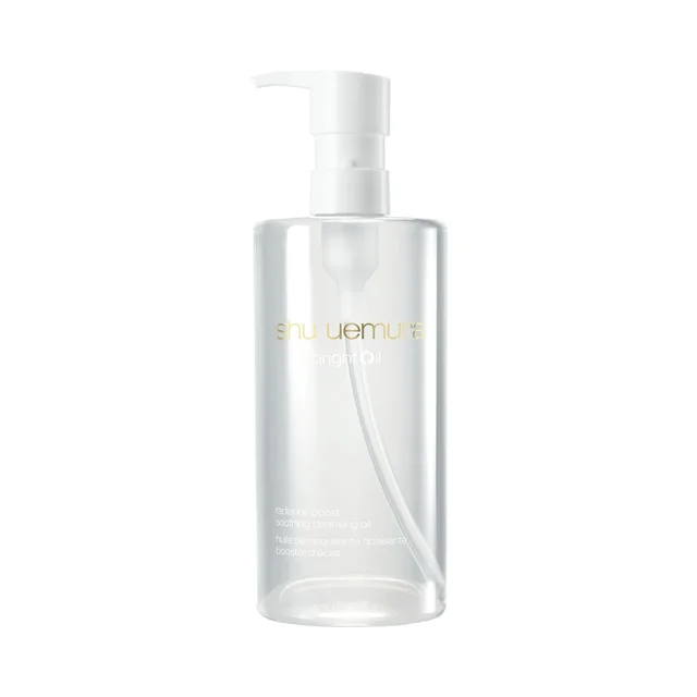 A clear, cylindrical plastic bottle of Shu Uemura brightOil radiance boost soothing cleansing oil with a white pump dispenser, set against a plain white background.